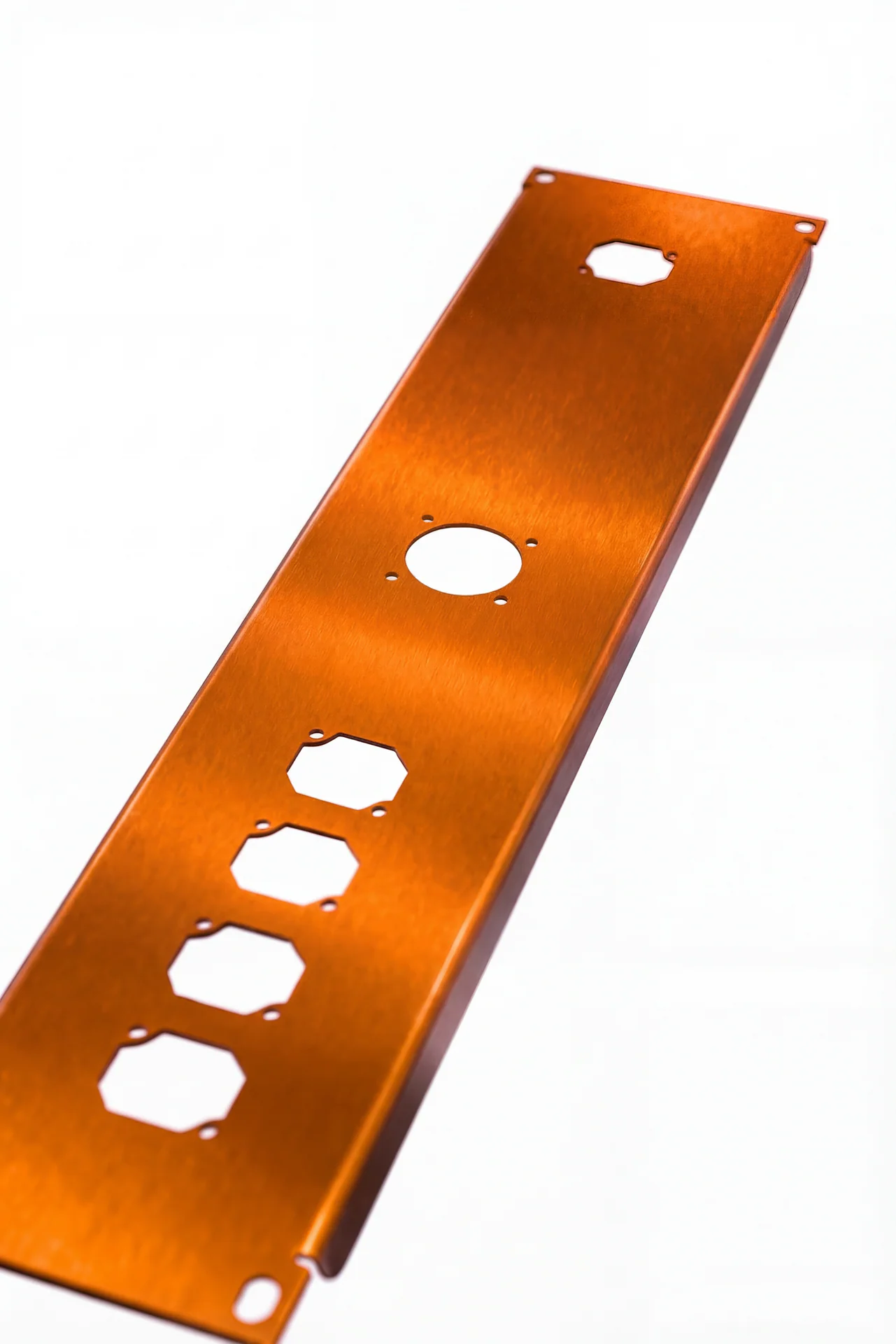 Orange anodized aluminum connector panel with round and rectangular openings