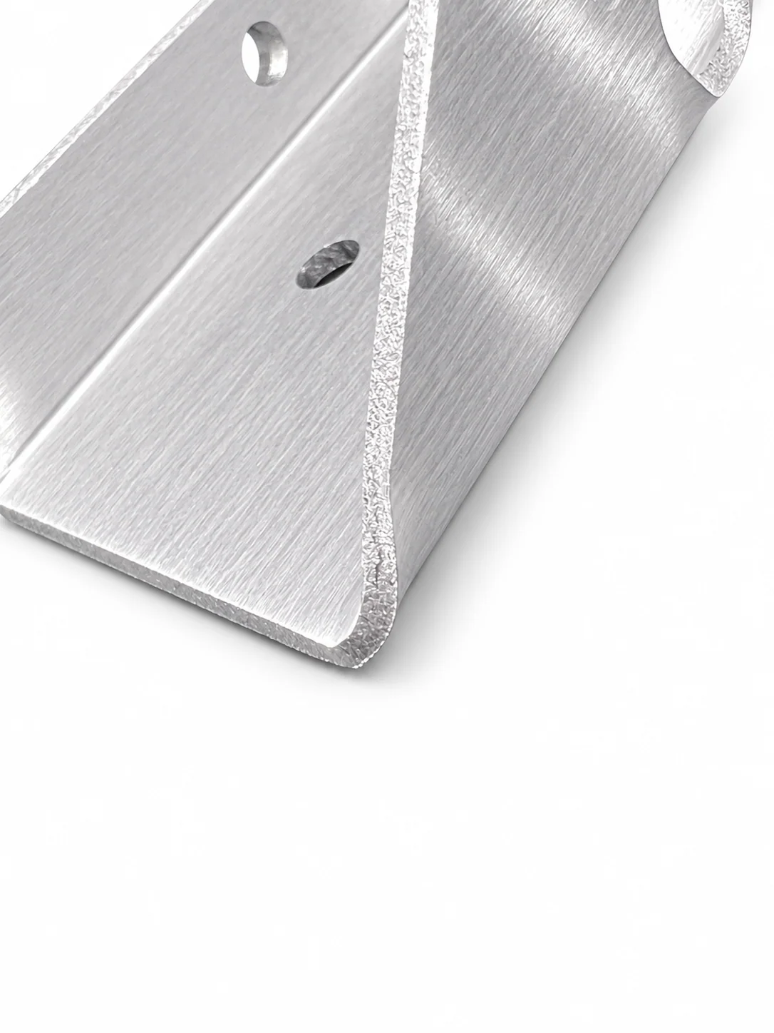 Illustrated end view of a bent sheet-metal flange showing the inside radius and nearby holes
