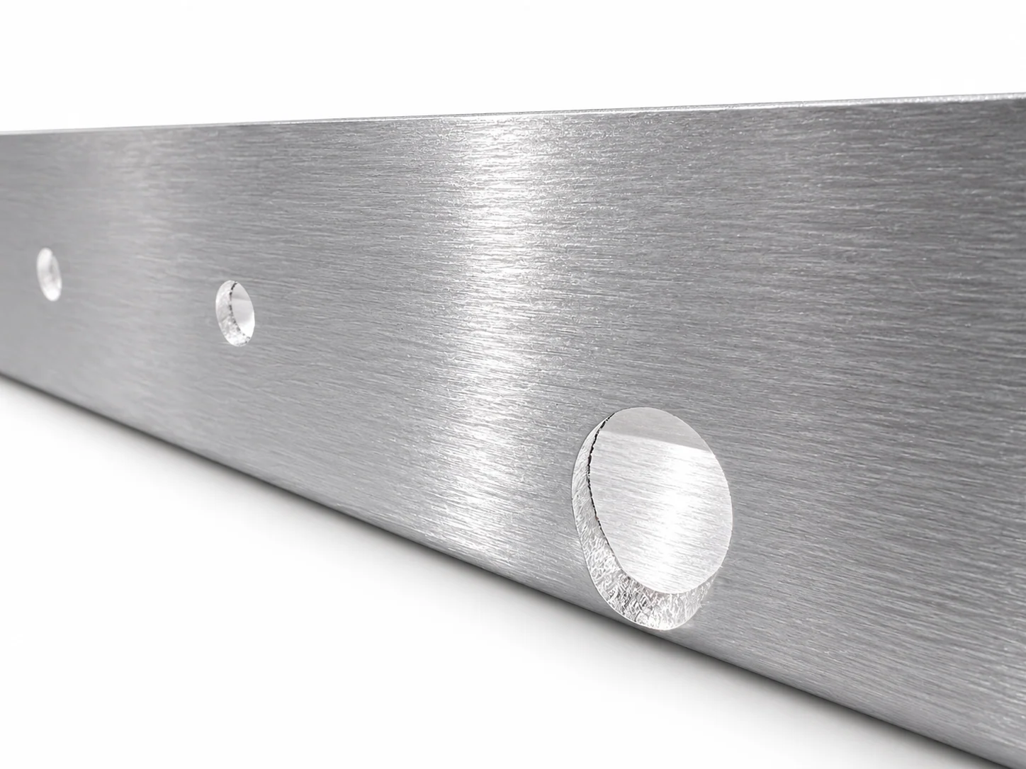 Close-up illustration of a projecting lower lip around a hole near a sheet-metal bend