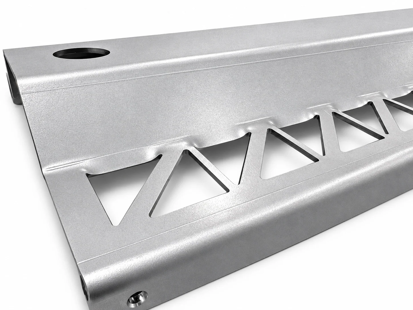 Illustration of a formed sheet-metal panel with triangular cutouts and uneven edges near the bend