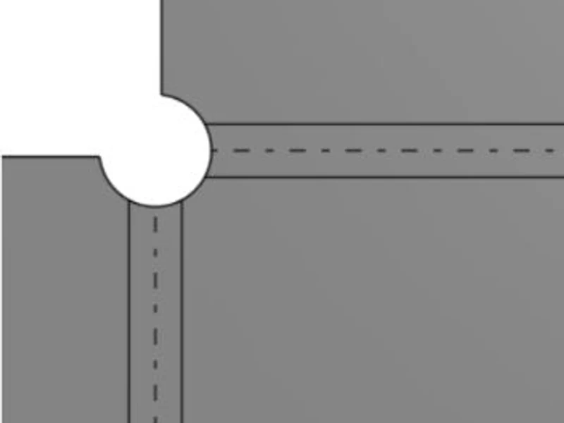 Flat pattern showing a round cutout at the bend intersection that is larger than the 0.500 inch sized round