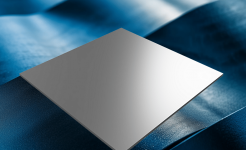 A smooth metal sheet floating over a textured, wavy blue surface under soft lighting.